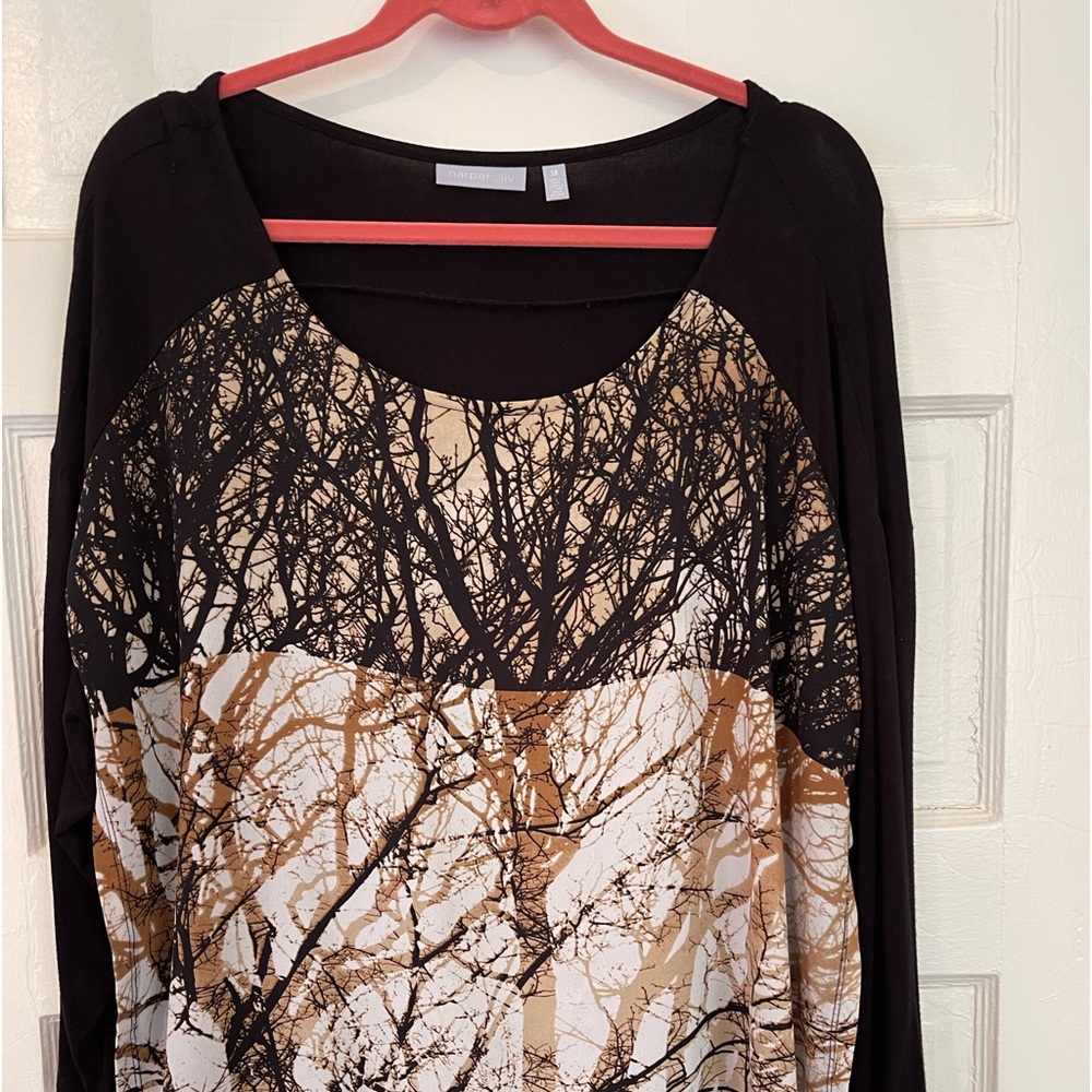 Black shirt with overlay piece in front.
